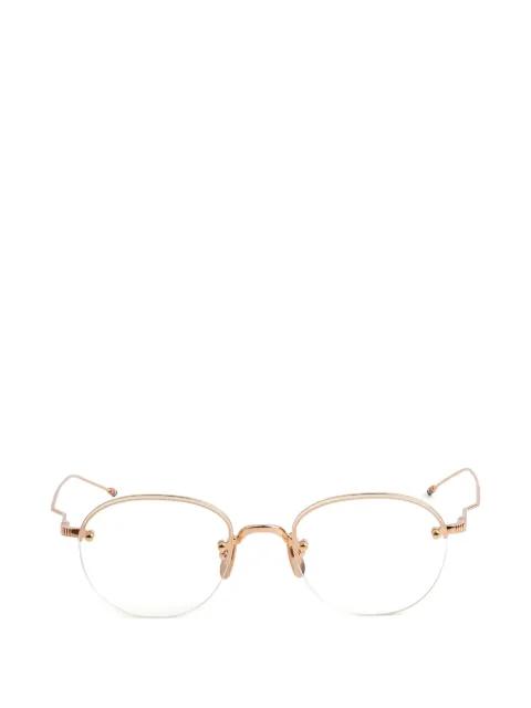 round-frame glasses by THOM BROWNE