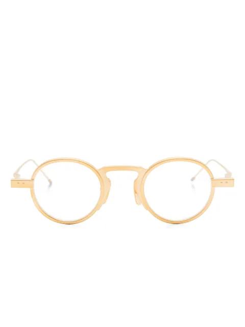 round-frame glasses by THOM BROWNE