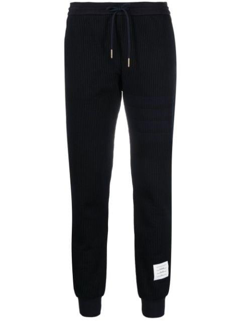 seersucker track pants by THOM BROWNE
