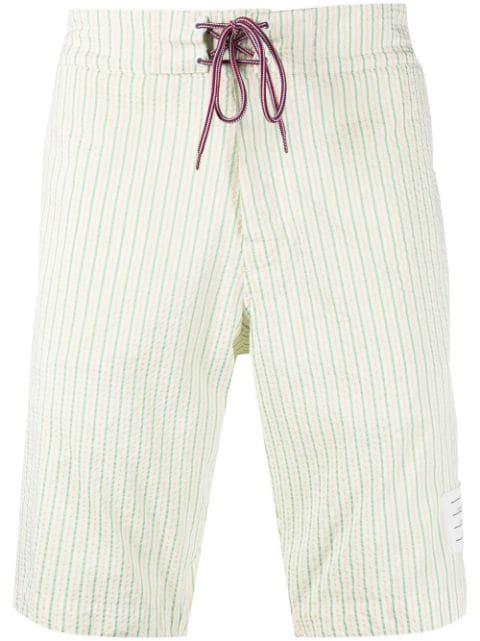 striped swimming shorts by THOM BROWNE