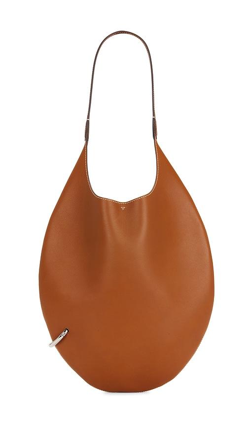 Tory Burch Pierced Soft Bag in Tan by TORY BURCH