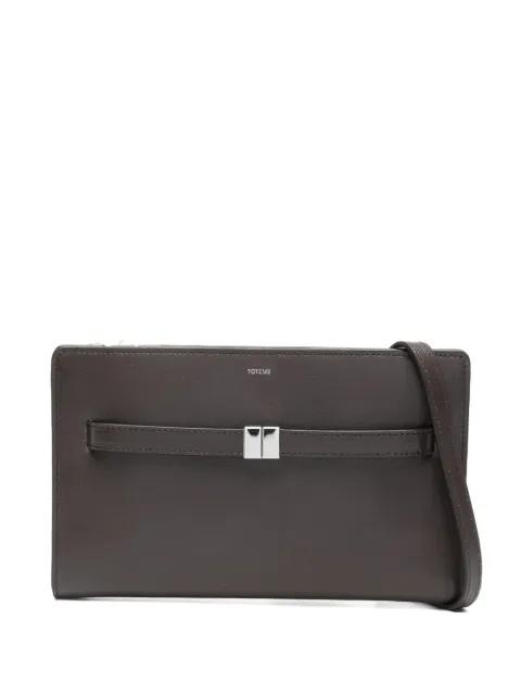 belted leather cross body bag by TOTEME