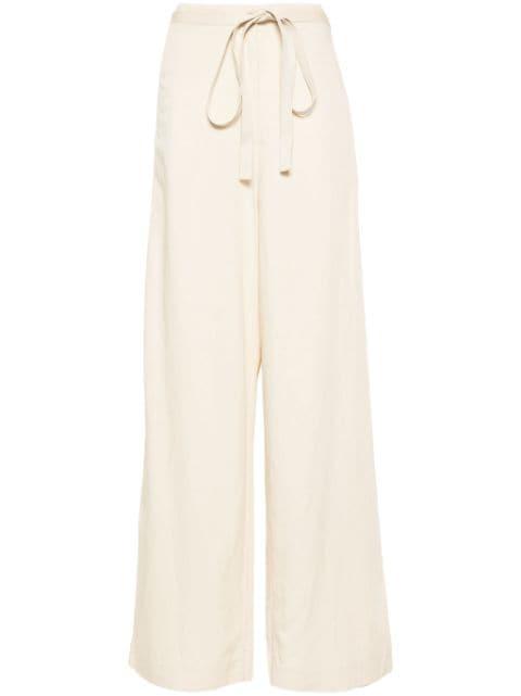 belted-waist flared trousers by TOTEME