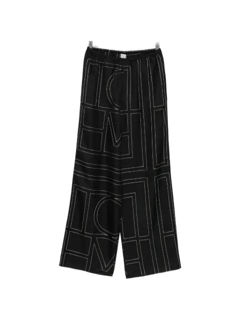 monogram silk trousers by TOTEME