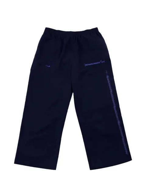 x Fragment x Nike Tokyo logo-print trousers by TRAVIS SCOTT