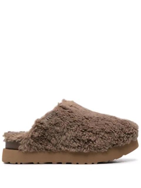 platform shearling slippers by UGG