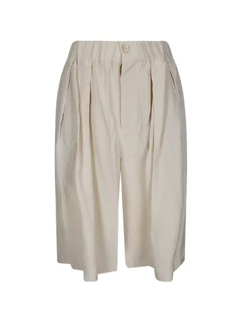 Poela chevron-pattern trousers by UMA WANG
