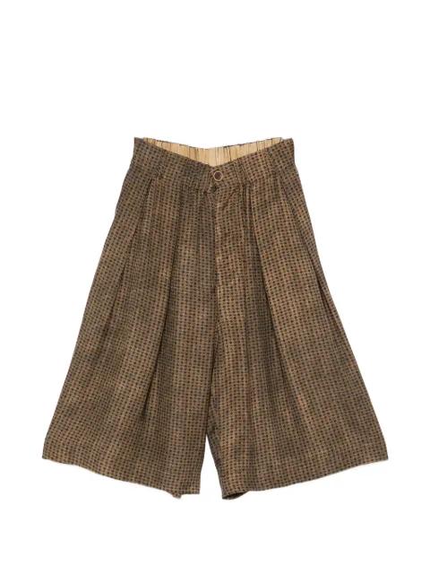 Poela geometric-pattern trousers by UMA WANG