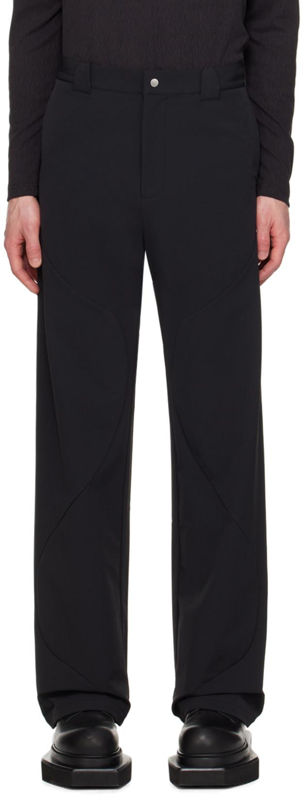 Black Roll Trousers by UNCERTAIN FACTOR