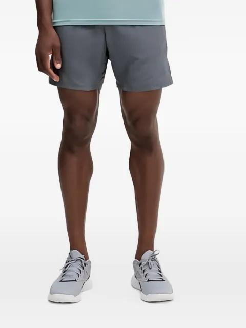 logo-print running shorts by UNDER ARMOUR