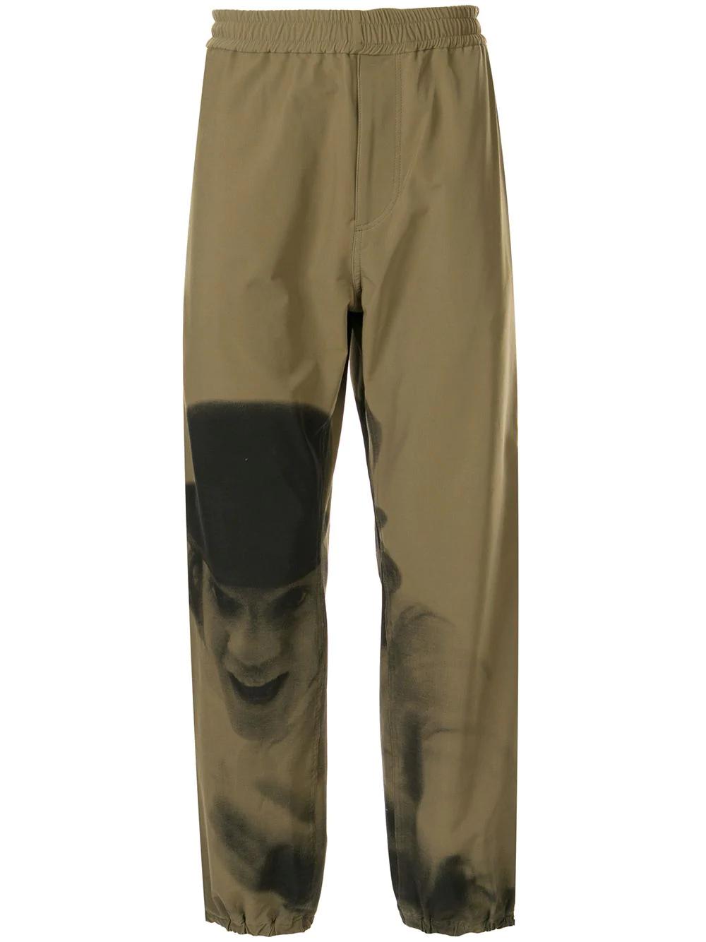 A Clockwork Orange print track pants by UNDERCOVER