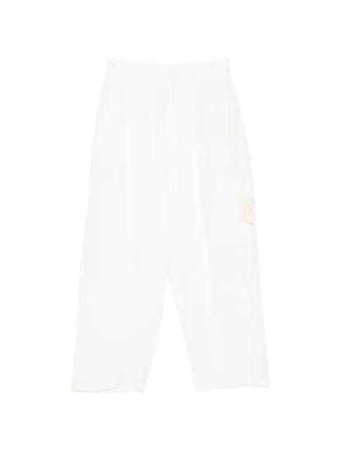 logo-patch trousers by UNDERCOVER
