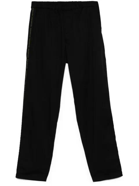 logo tape-detail trousers by UNDERCOVER