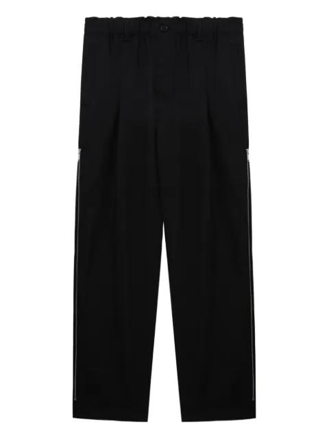 pleated zip-detail trousers by UNDERCOVER