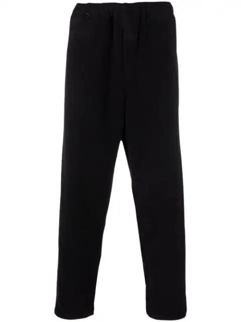x Evangelion manga-embroidery track pants by UNDERCOVER