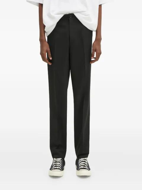 zip-pocket trousers by UNDERCOVER