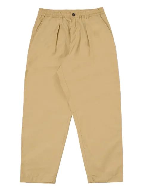 pleated utility trousers by UNIVERSAL WORKS