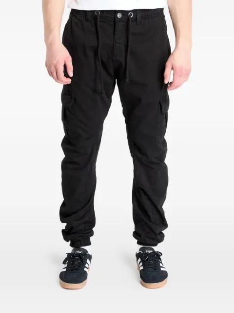 elasticated-cuff buttoned trousers by URBAN CLASSICS