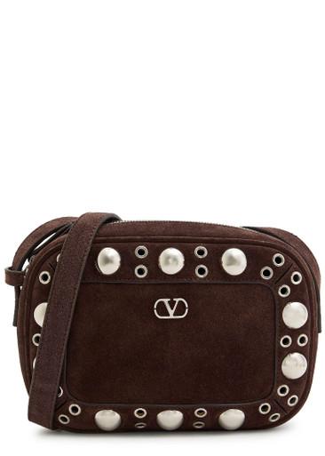 Nellcôte studded suede cross-body bag by VALENTINO