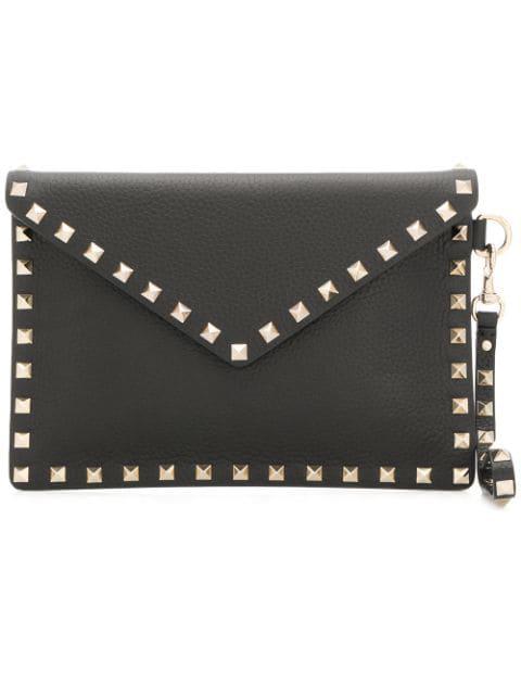 Rockstud envelope clutch by VALENTINO