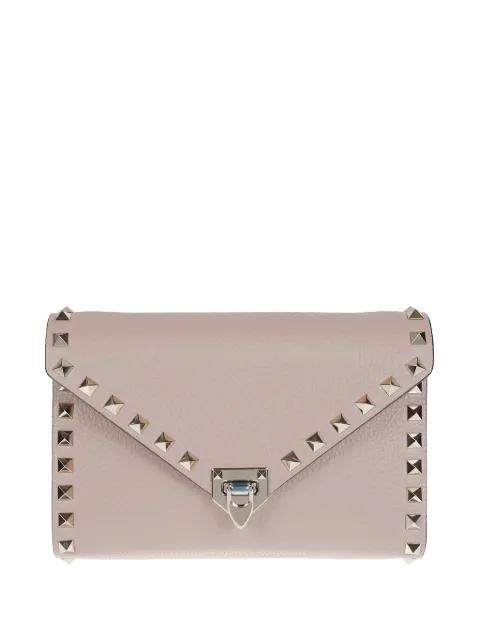 Rockstud leather clutch bag by VALENTINO