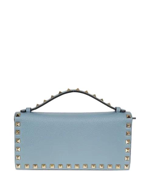 Rockstud leather clutch bag by VALENTINO