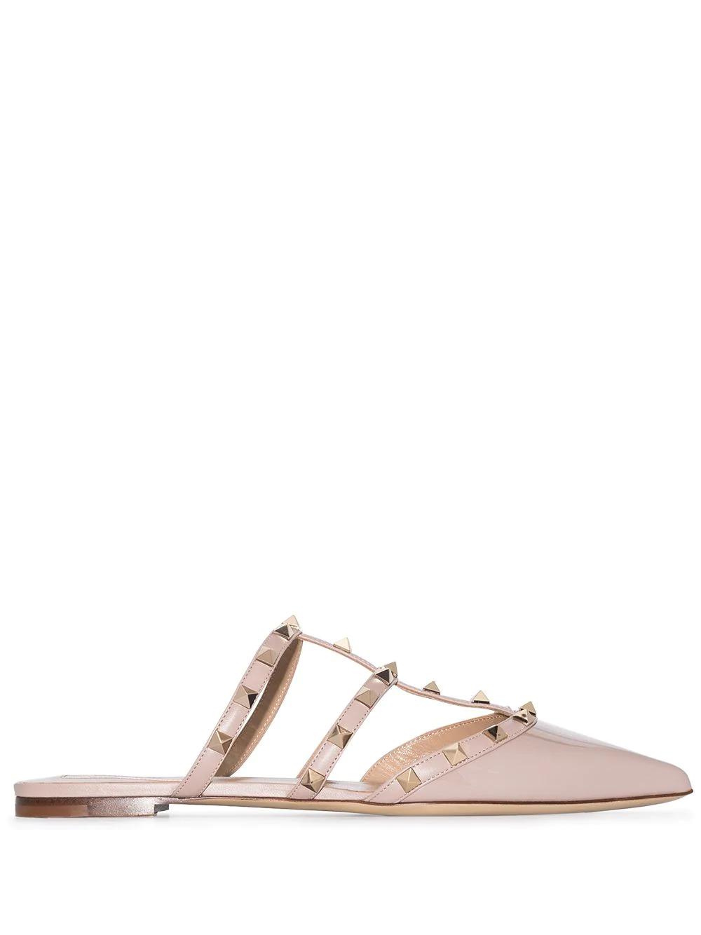 Rockstud patent leather mules by VALENTINO