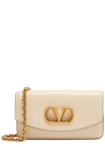 Vain small Vlogo leather clutch by VALENTINO