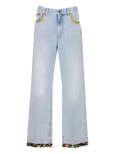 floral-hem embroidered jeans by VALENTINO