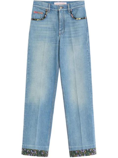 floral-trim jeans by VALENTINO