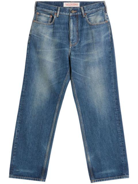 logo-patch washed straight-leg jeans by VALENTINO