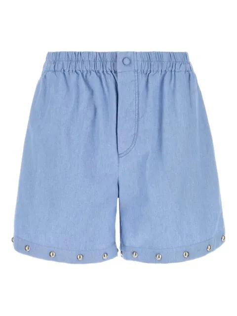 stud-embellished denim shorts by VALENTINO