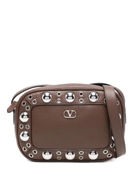 studded leather messenger bag by VALENTINO