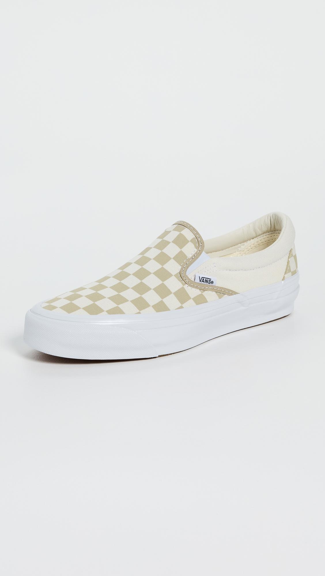 Classic Checkerboard Slip On Sneakers by VANS