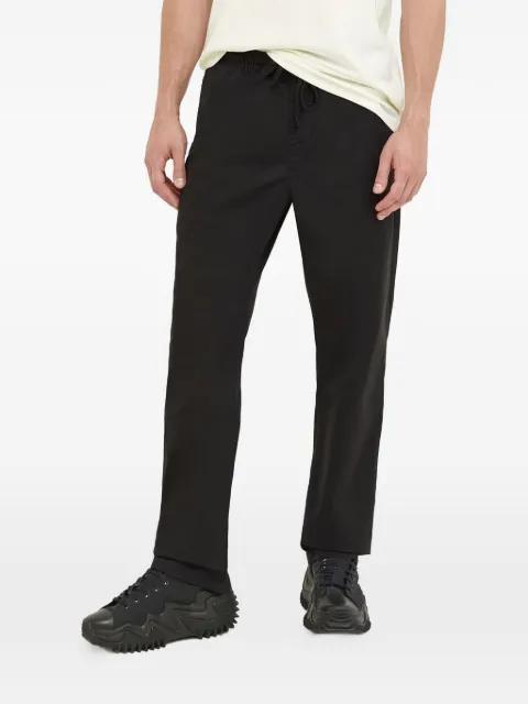 logo-patch trousers by VANS
