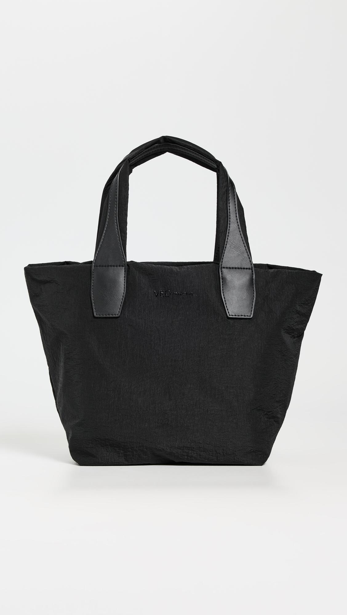 Porter Essence Small Black Paper Bag by VEE COLLECTIVE