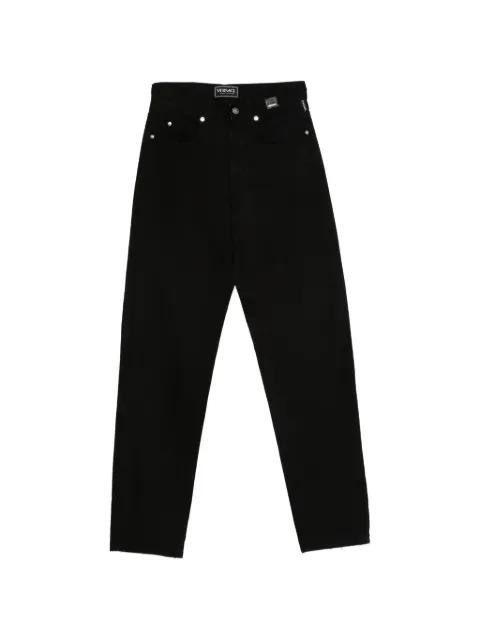 1990s logo-patch trousers by VERSACE 