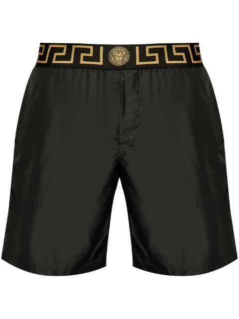 Greca border swim shorts by VERSACE