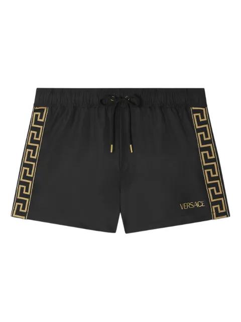 Greca drawstring swim shorts by VERSACE