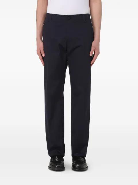 Medusa-appliqué pants by VERSACE
