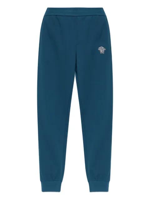 Medusa appliqué track pants by VERSACE