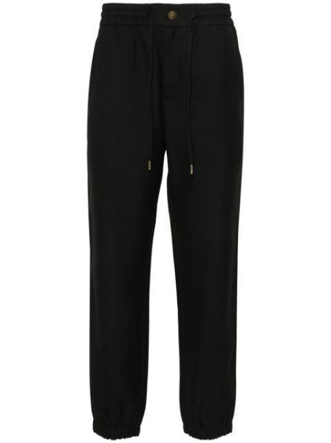V-Emblem tapered trousers by VERSACE