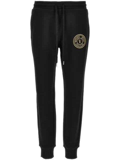 V-Emblem track trousers by VERSACE