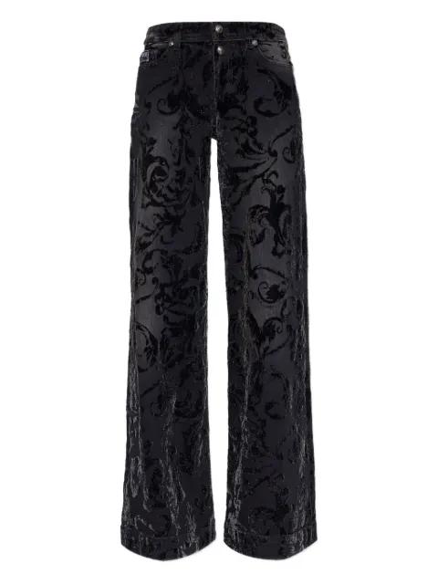 floral-pattern flared jeans by VERSACE