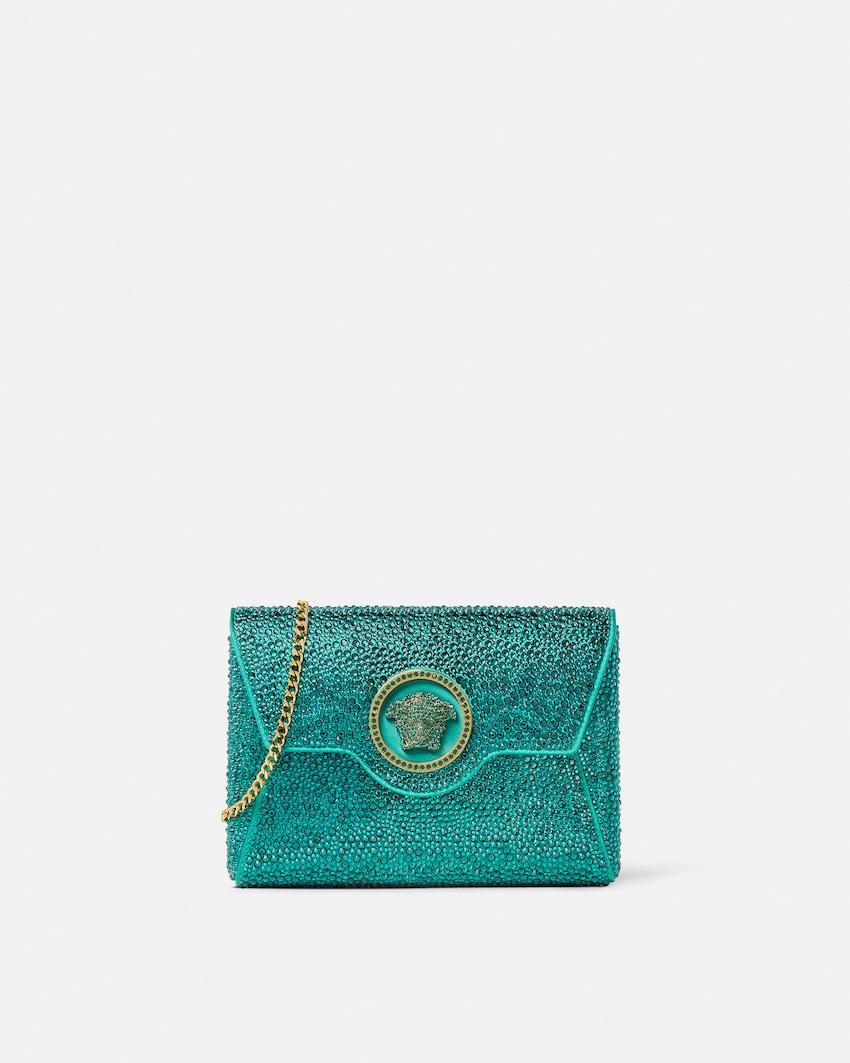 la medusa embellished satin clutch by VERSACE