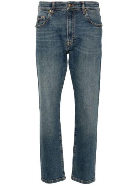 logo-embroidered slim-cut jeans by VERSACE