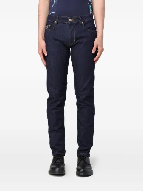 logo-patch five-pocket jeans by VERSACE