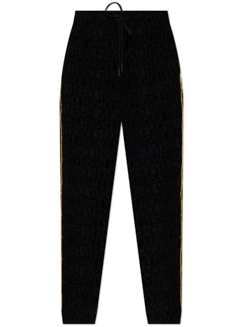 logo-patterned side-stripe trousers by VERSACE