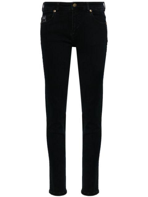 logo-plaque skinny jeans by VERSACE