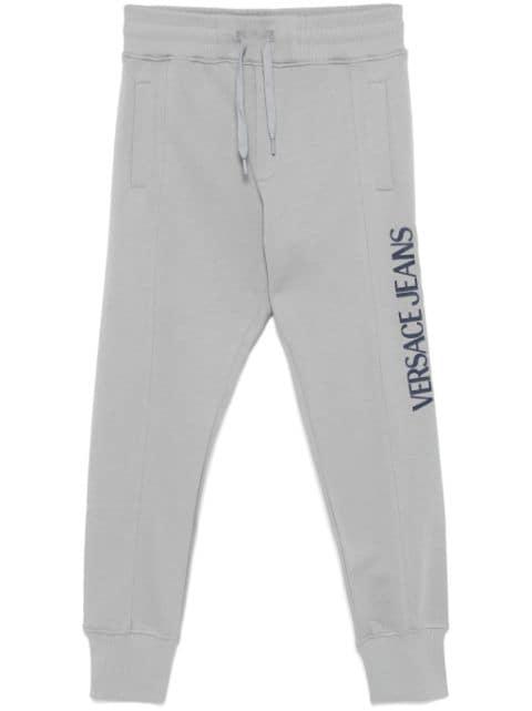 logo-print track pants by VERSACE